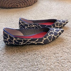 Rothy’s navy giraffe print flats